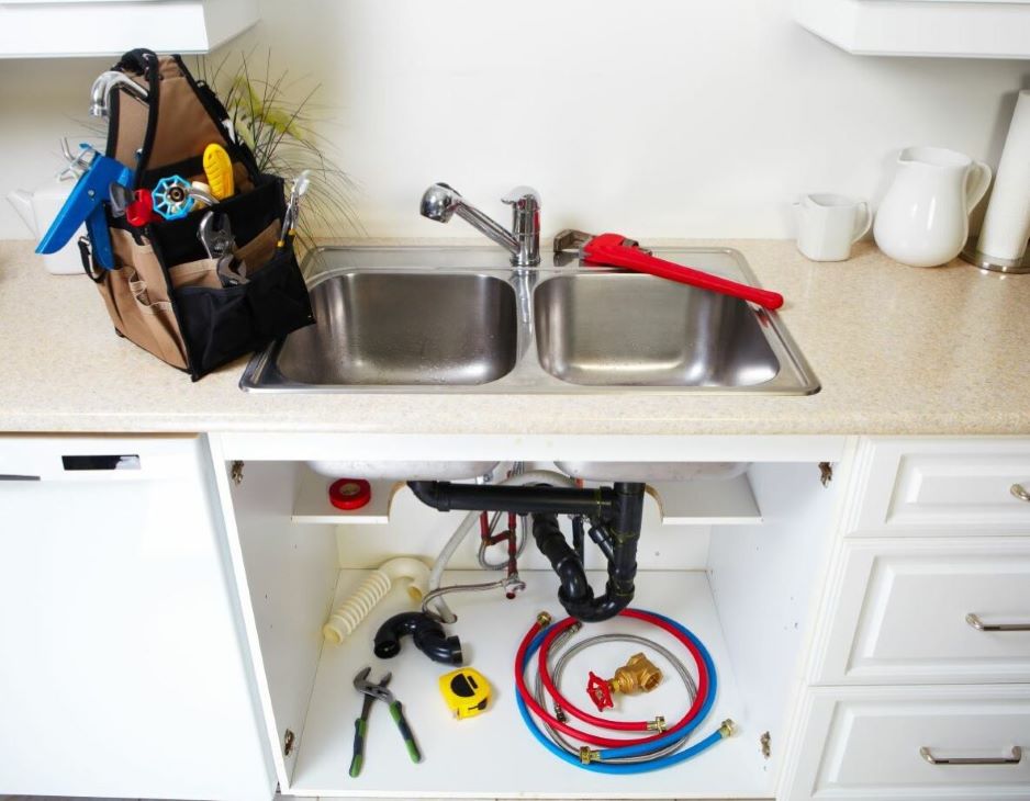 plumber tools and under kitchen sink