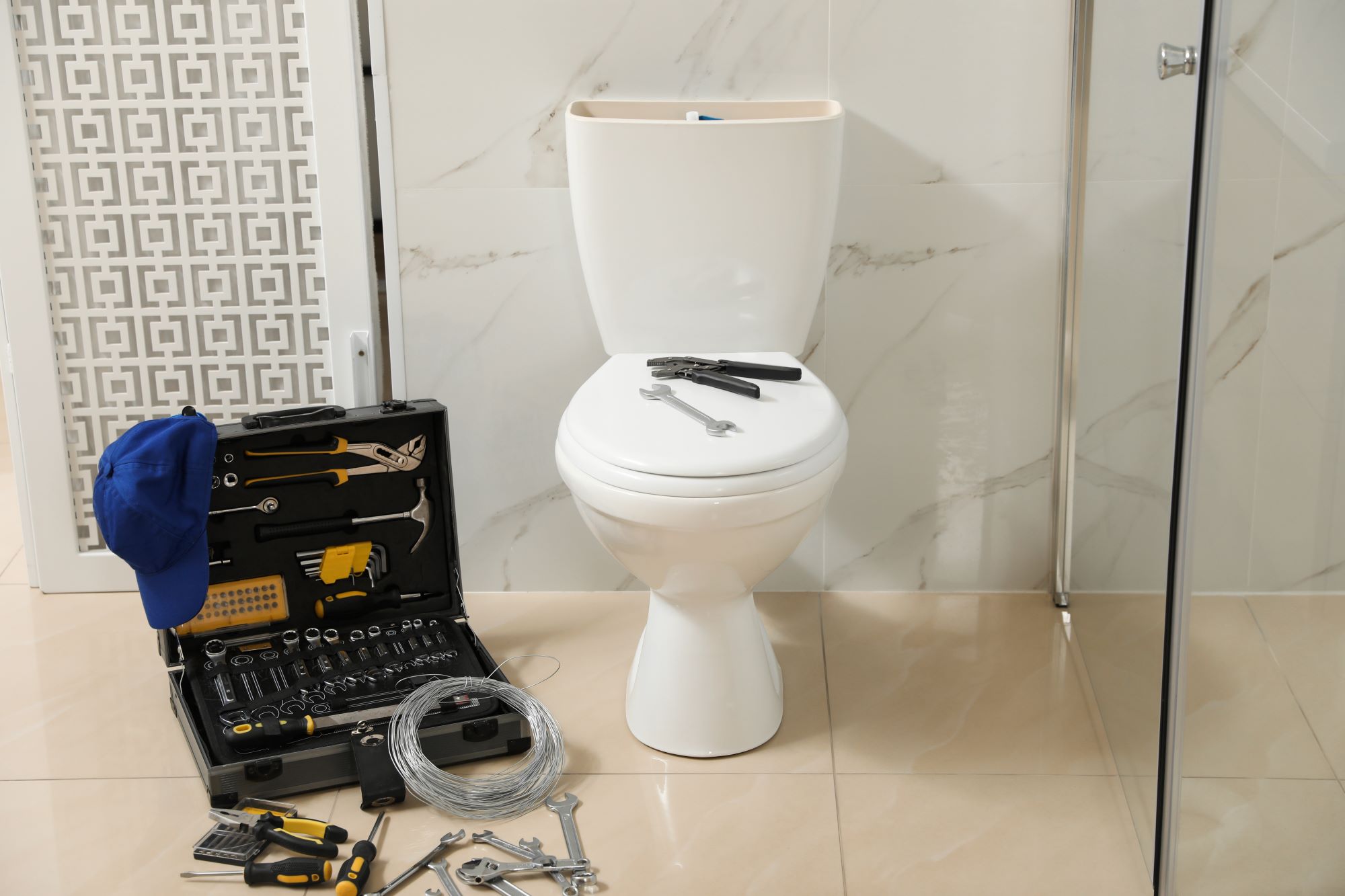 toilet being repaired with tools